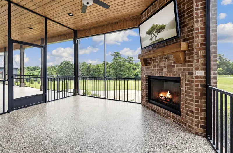 Screened porch with fireplace, The Arched Brick Ranch