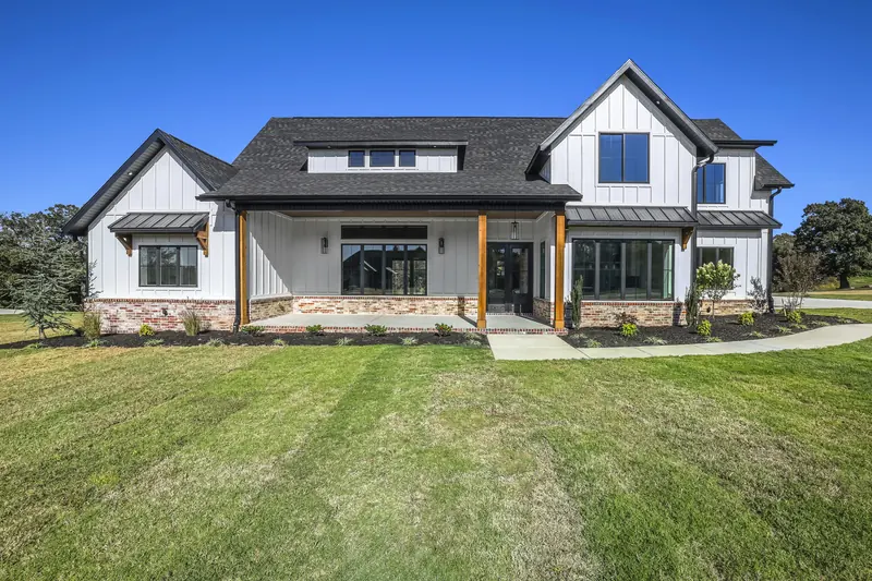 Modern farmhouse with pool and covered patio