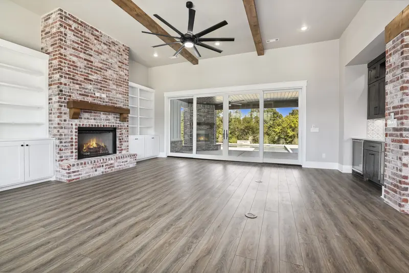 Living room with brick fireplace, The Modern Farmhouse