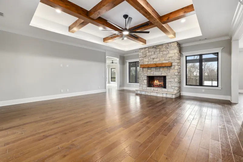 Great room with beams, The Stone & Timber Ranch