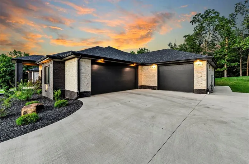Garage and drive at dusk, The Sunset Modern Ranch