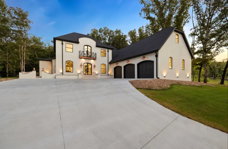 White brick estate with black-steel windows