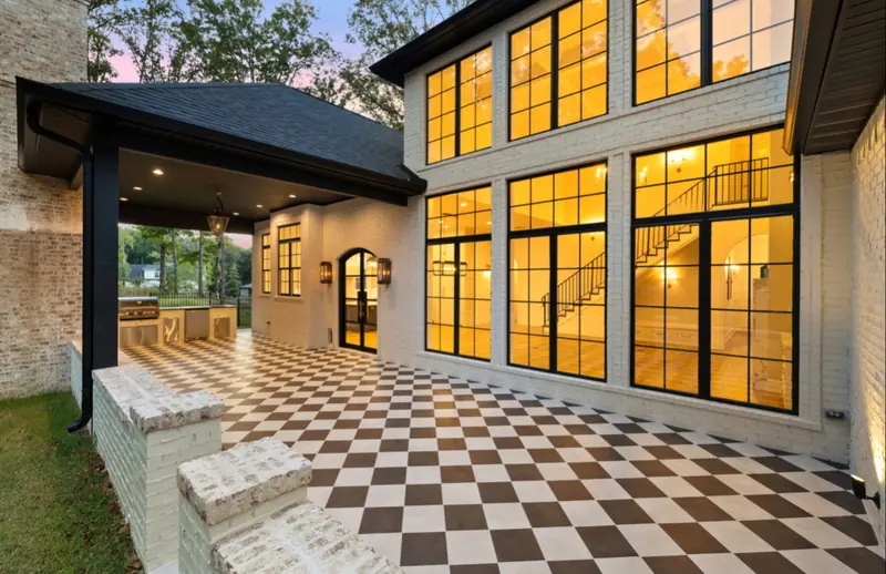 Two-story window wall and patio, The White Brick Estate